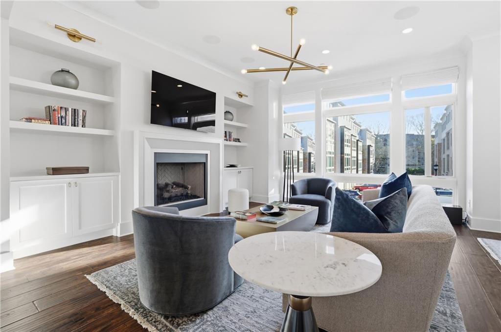 773 Lenox Lane Atlanta, GA 30324 - Photo 15 of 54 a living room with fireplace furniture and a flat screen tv