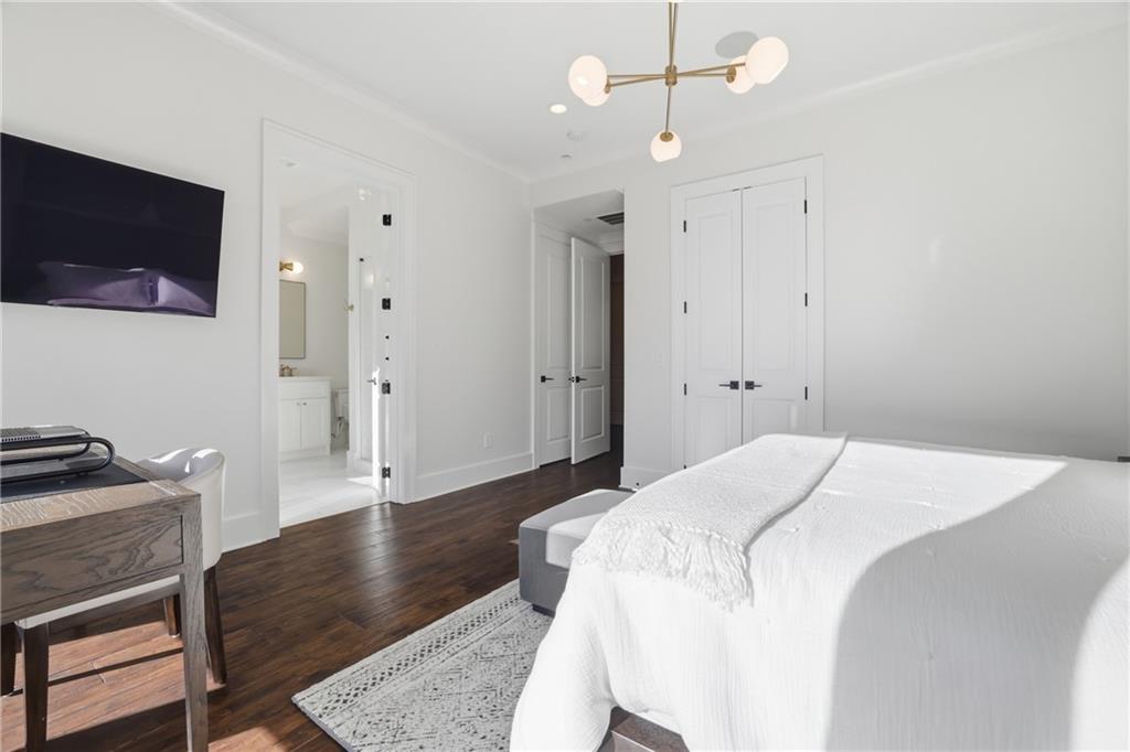 773 Lenox Lane Atlanta, GA 30324 - Photo 27 of 54 a bedroom with a bed and a flat screen tv