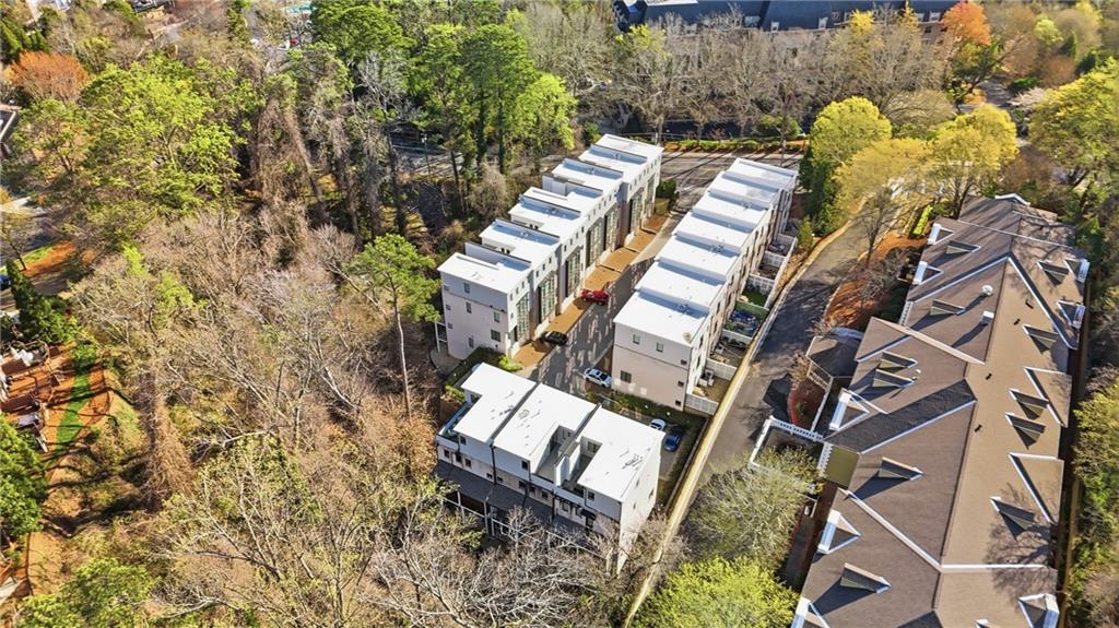 773 Lenox Lane Atlanta, GA 30324 - Photo 50 of 54 a view of a swimming pool with lawn chairs and wooden fence