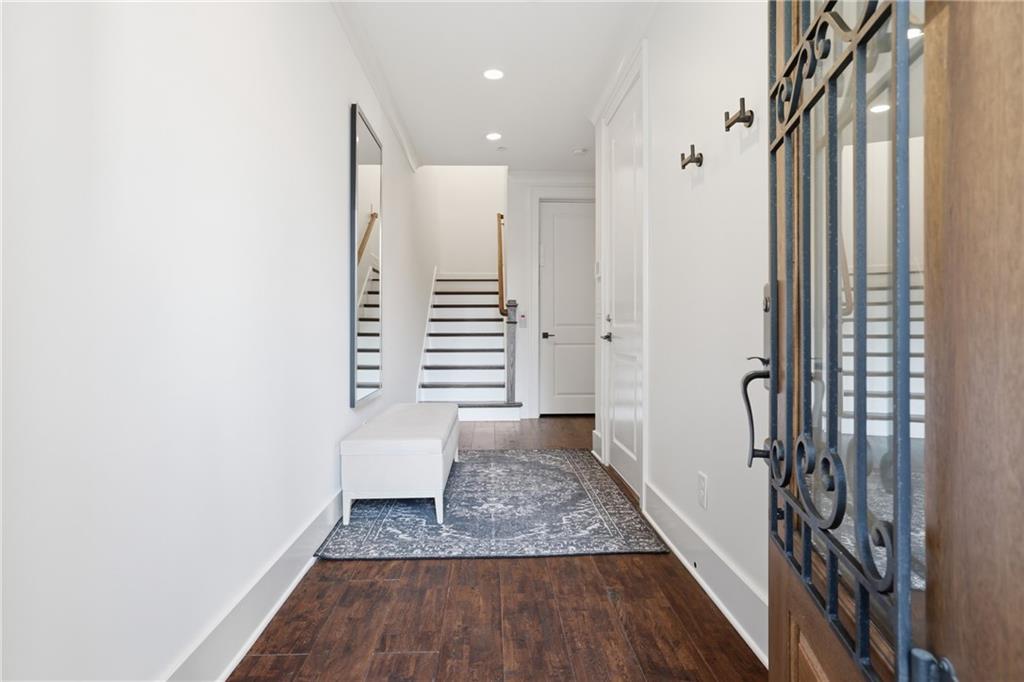 773 Lenox Lane Atlanta, GA 30324 - Photo 5 of 54 a view of a hallway with wooden floor and staircase