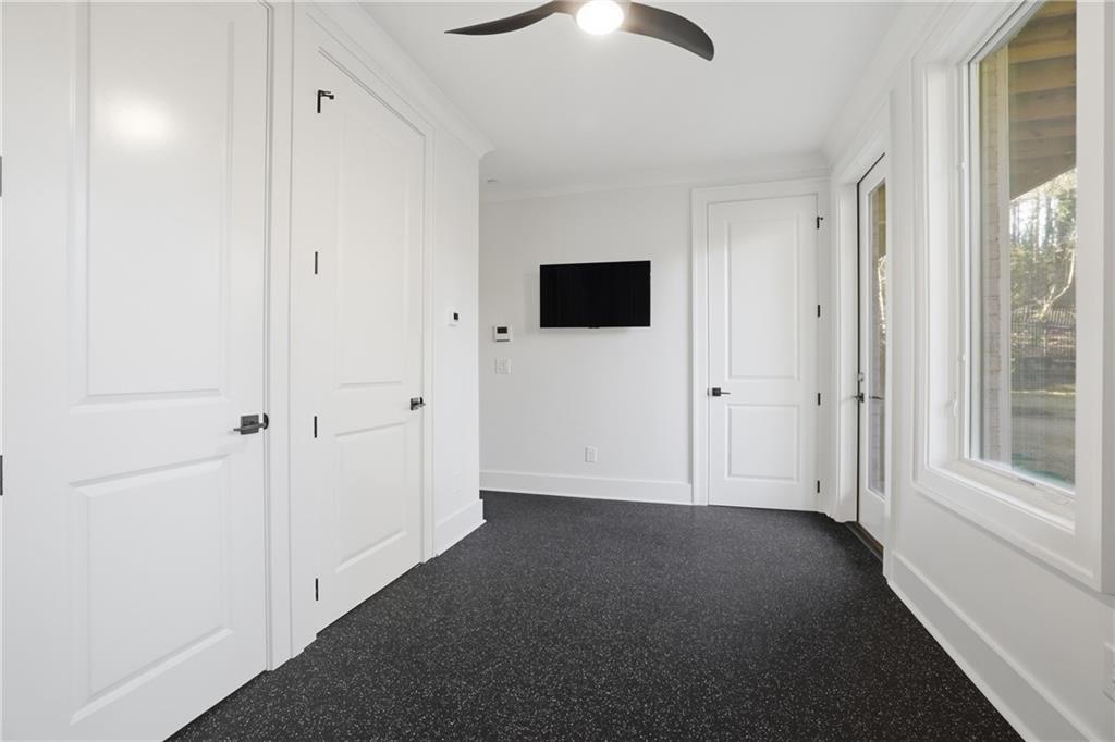 773 Lenox Lane Atlanta, GA 30324 - Photo 9 of 54 an empty room with ceiling fan and window