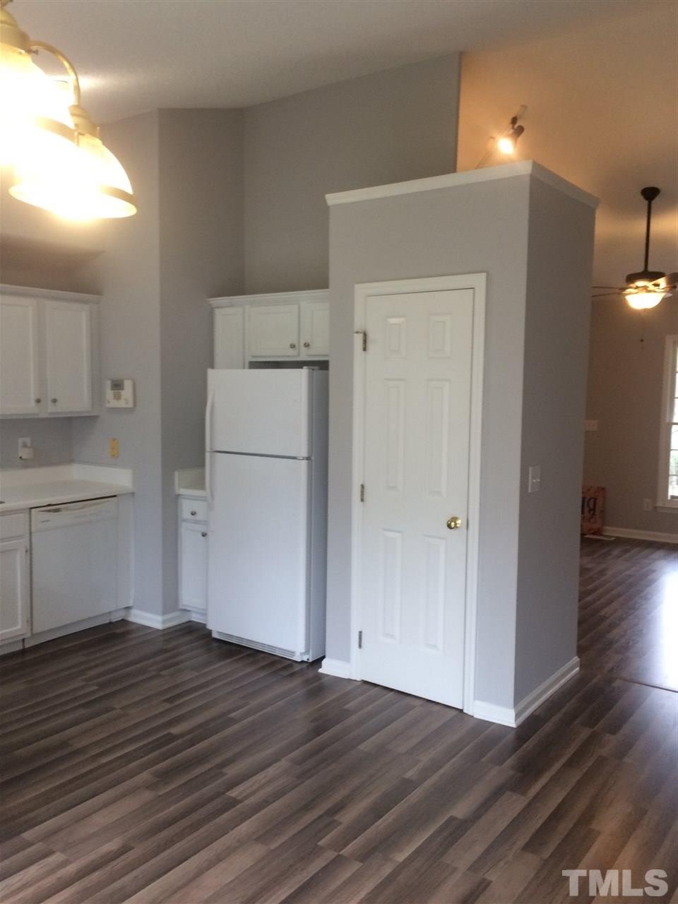 2305 Havering Place Raleigh, NC 27604 - Photo 7 of 10 a view of a kitchen with wooden floor and a sink