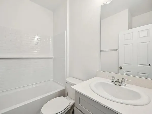 a bathroom with a sink toilet and bathtub