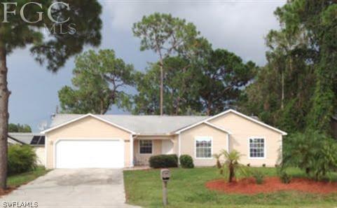 18513 Sunflower Road Fort Myers, FL 33967 - Photo 1 of 14 a view of front a house with a yard and potted plants