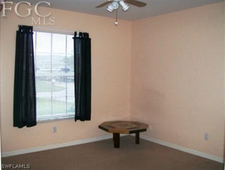 18513 Sunflower Road Fort Myers, FL 33967 - Photo 11 of 14 an empty room with windows and entrance