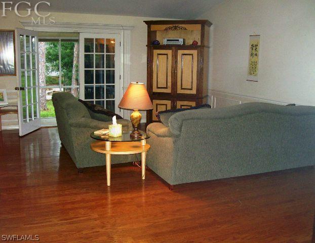 18513 Sunflower Road Fort Myers, FL 33967 - Photo 2 of 14 a living room with furniture and a large window