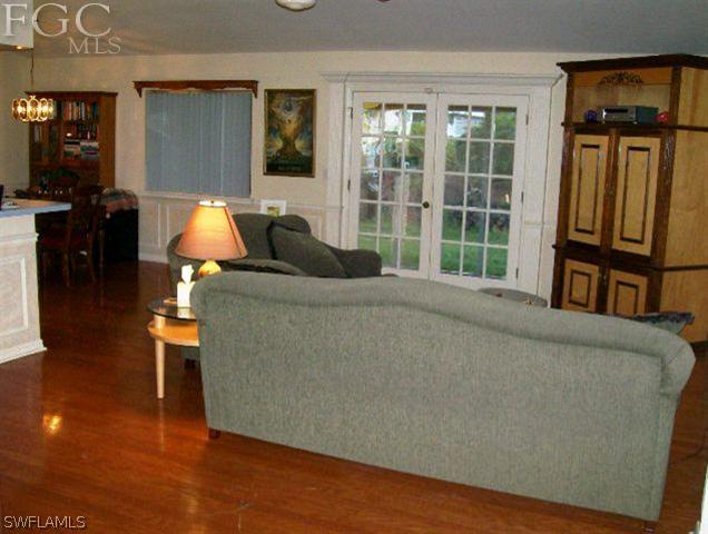 18513 Sunflower Road Fort Myers, FL 33967 - Photo 3 of 14 a living room with furniture and a floor to ceiling window