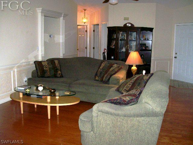 18513 Sunflower Road Fort Myers, FL 33967 - Photo 4 of 14 a living room with furniture rug and wooden floor