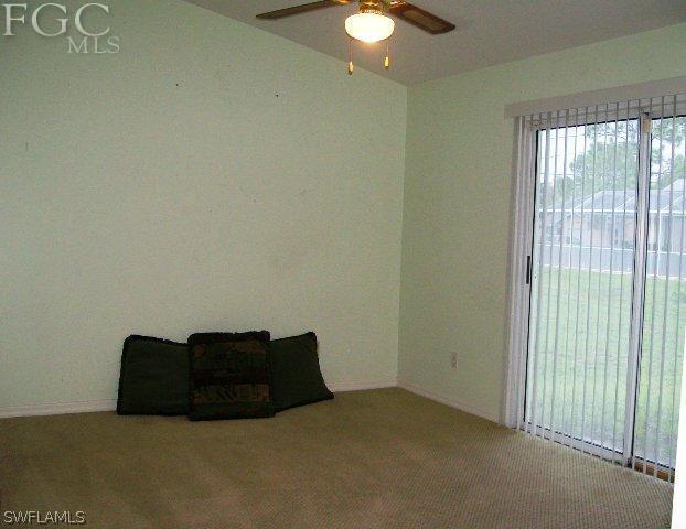 18513 Sunflower Road Fort Myers, FL 33967 - Photo 9 of 14 a bed sitting in a room next to a window