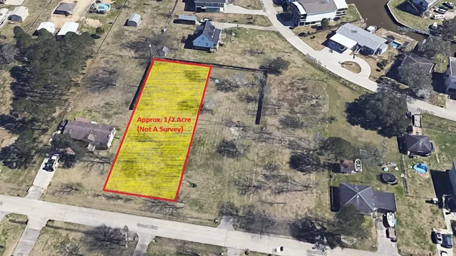 an aerial view of residential house with pool and lawn chairs