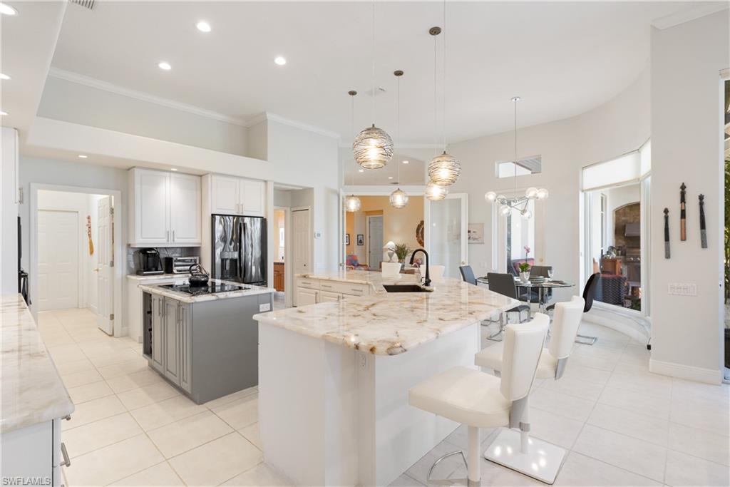 11290 Compass Point Drive Fort Myers, FL 33908 - Photo 11 of 50 a view of a kitchen and kitchen island