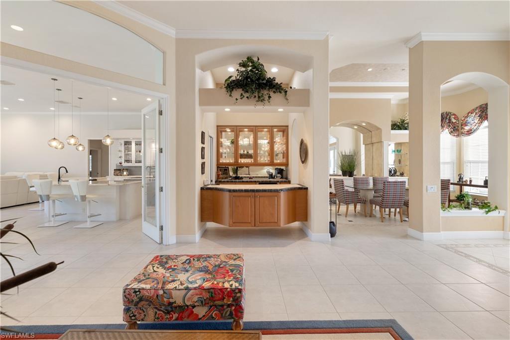 11290 Compass Point Drive Fort Myers, FL 33908 - Photo 18 of 50 a living room with furniture and kitchen view