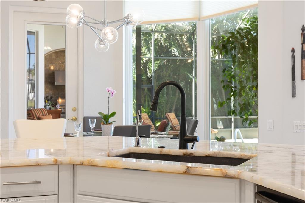 11290 Compass Point Drive Fort Myers, FL 33908 - Photo 37 of 50 a bathroom with a granite countertop sink and a large mirror