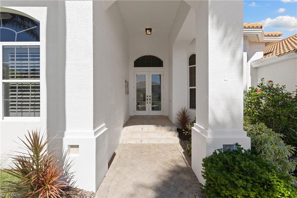 11290 Compass Point Drive Fort Myers, FL 33908 - Photo 7 of 50 a front view of a house with a yard