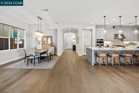 a view of a dining room with furniture window and outside view