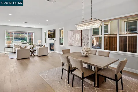 a living room with fireplace furniture and a flat screen tv