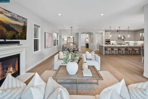 a large kitchen with a table and chairs