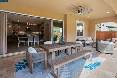 a living room with lots of furniture and a chandelier
