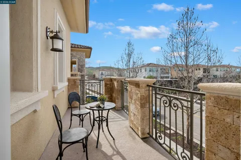 a view of a house with a yard porch and sitting area