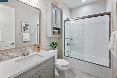 a view of a house with a yard and furniture