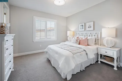 a view of a patio with table and chairs under an umbrella