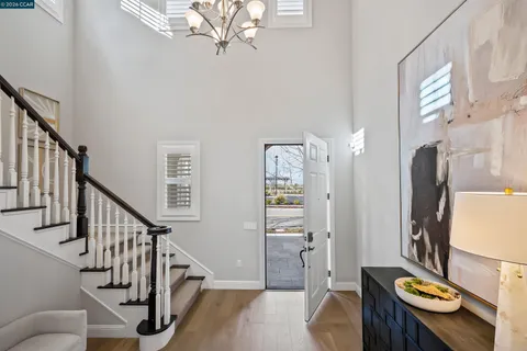 a large kitchen with a table and chairs