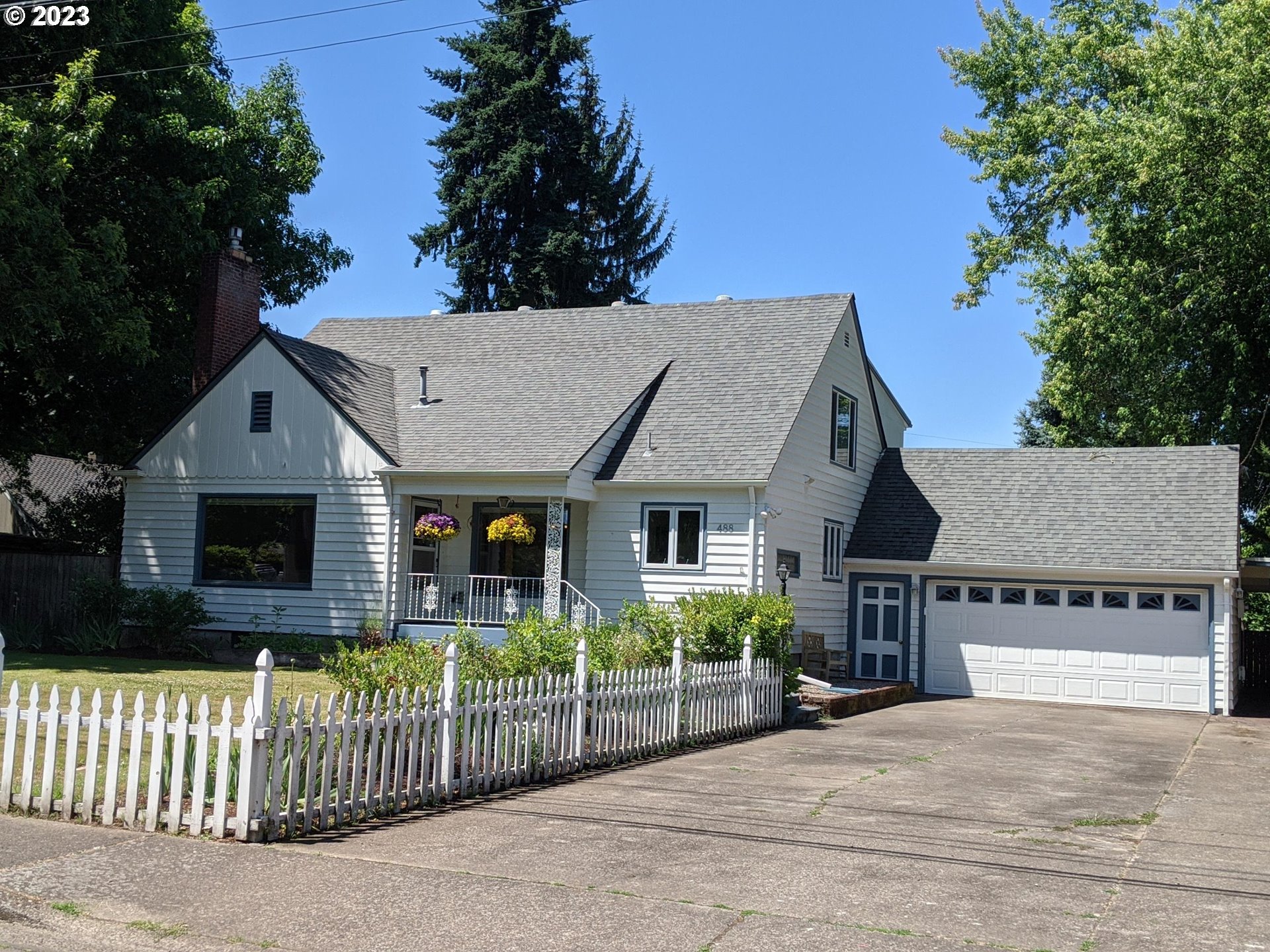 a front view of a house with garage