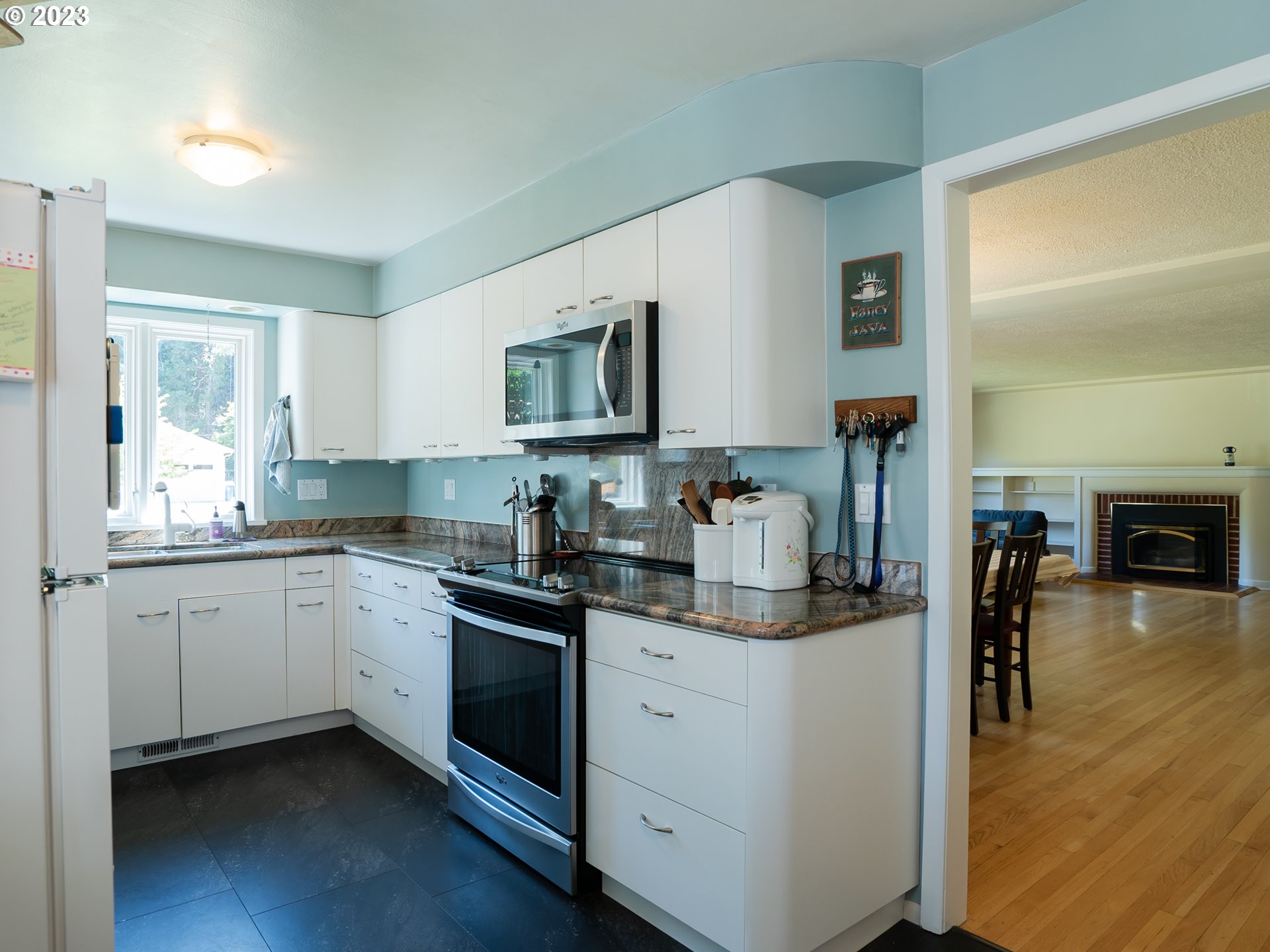 488 Sunshine Acres Drive Eugene, OR 97401 - Photo 11 of 40 a kitchen with sink cabinets and wooden floor
