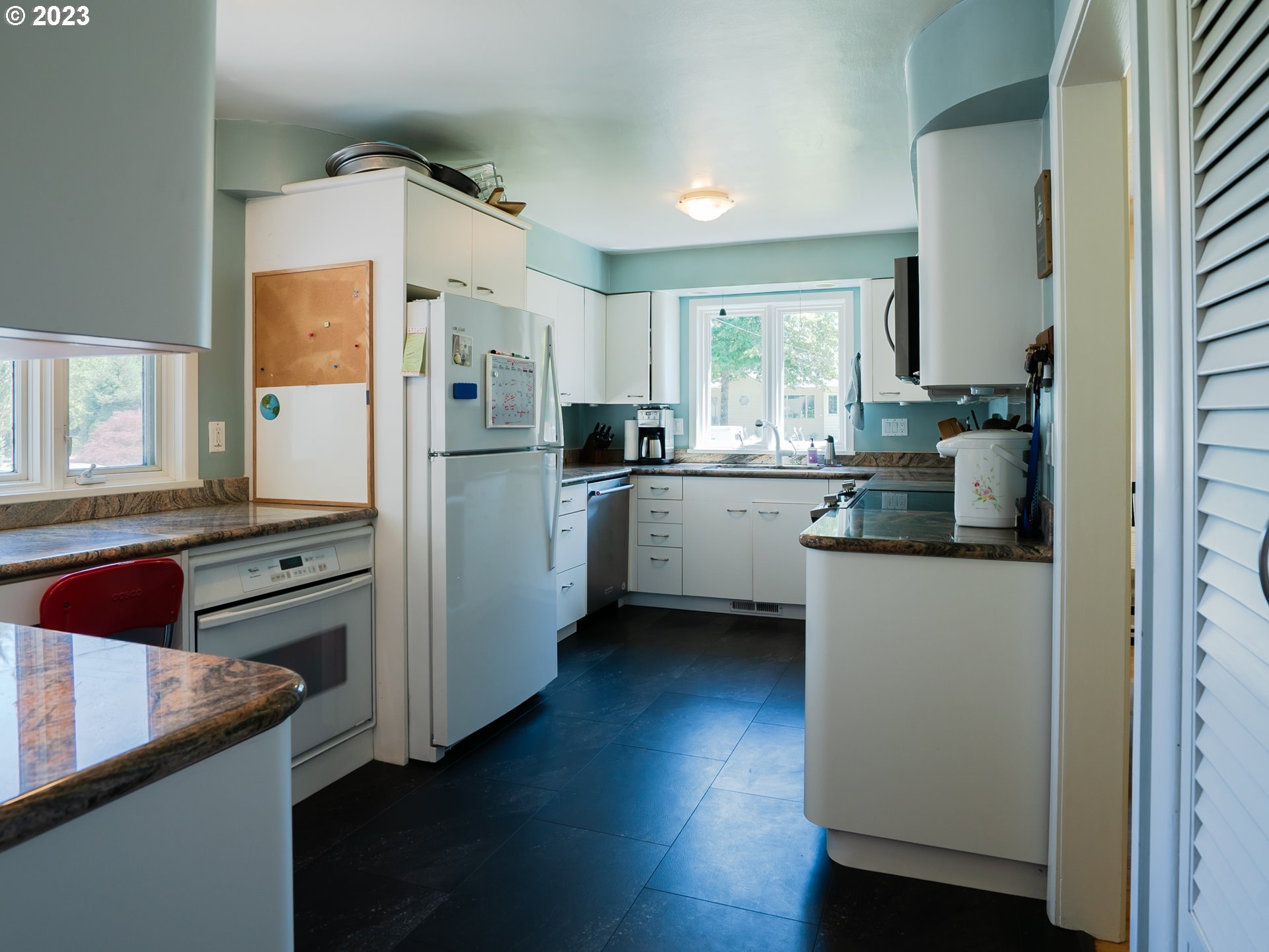 488 Sunshine Acres Drive Eugene, OR 97401 - Photo 13 of 40 a kitchen with stainless steel appliances granite countertop a refrigerator and a stove top oven
