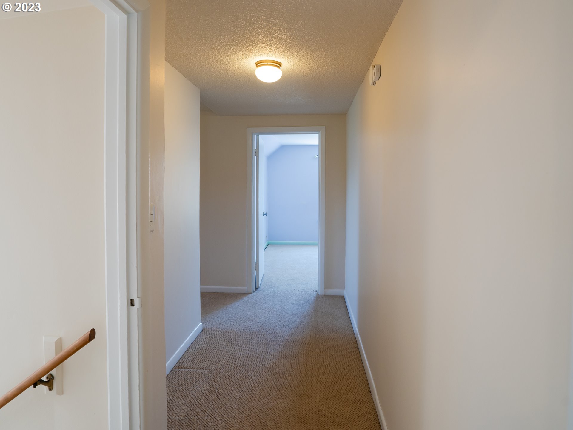 488 Sunshine Acres Drive Eugene, OR 97401 - Photo 21 of 40 a view of a hallway with wooden floor