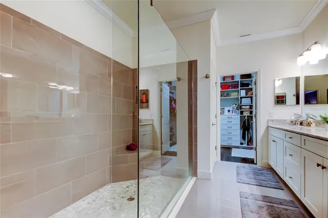 a bathroom with a shower and a sink
