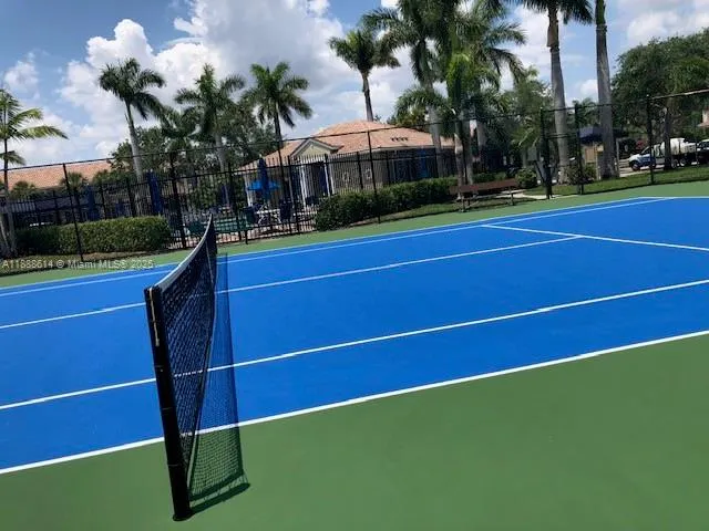 a view of outdoor space and tennis court