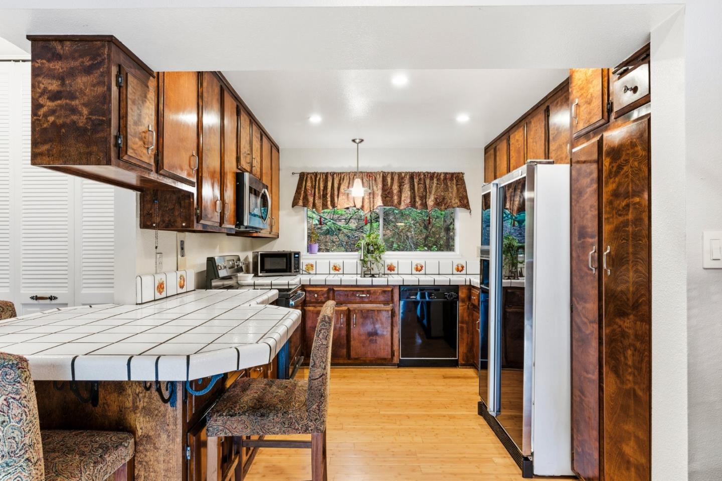 1743 Panda Way Hayward, CA 94541 - Photo 15 of 34 a kitchen with stainless steel appliances granite countertop a stove refrigerator sink and cabinets