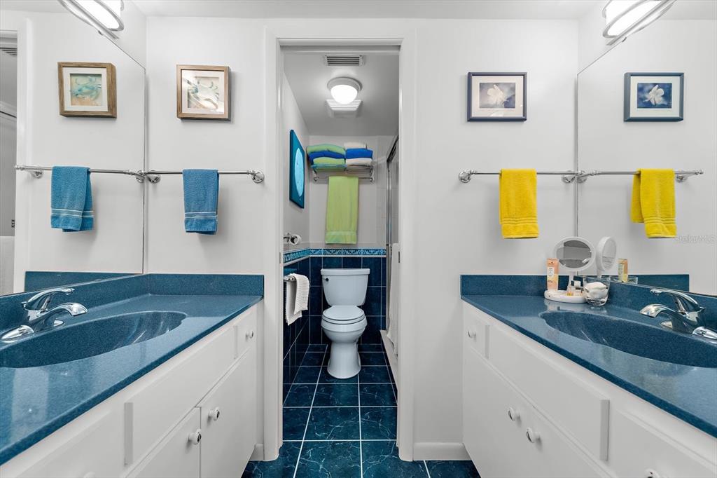 1551 Beach Road, Unit 207 Englewood, FL 34223 - Photo 17 of 40 a bathroom with a granite countertop sink and a mirror