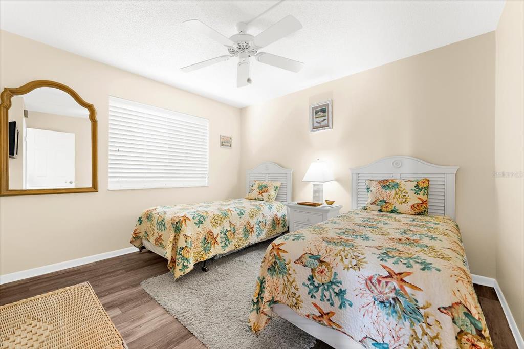 1551 Beach Road, Unit 207 Englewood, FL 34223 - Photo 18 of 40 a bedroom with two beds and a window