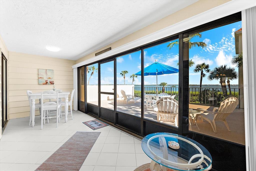 1551 Beach Road, Unit 207 Englewood, FL 34223 - Photo 24 of 40 a room with furniture and a large window