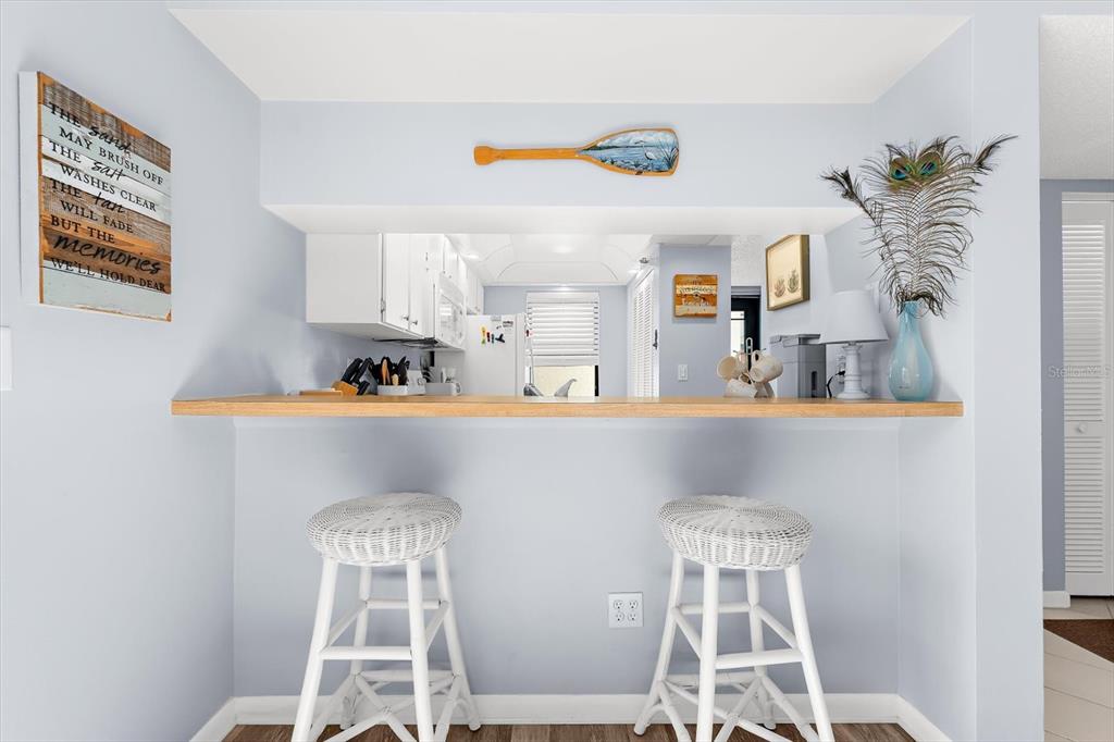 1551 Beach Road, Unit 207 Englewood, FL 34223 - Photo 5 of 40 a dining room with furniture and window