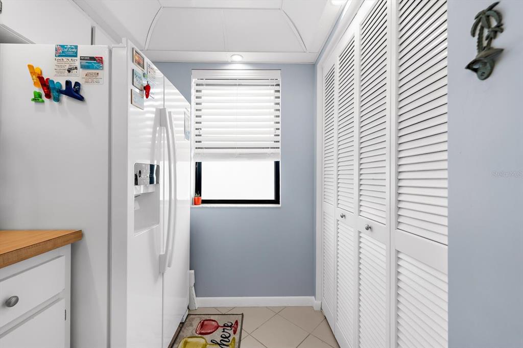 1551 Beach Road, Unit 207 Englewood, FL 34223 - Photo 6 of 40 a bathroom with a window and a shower