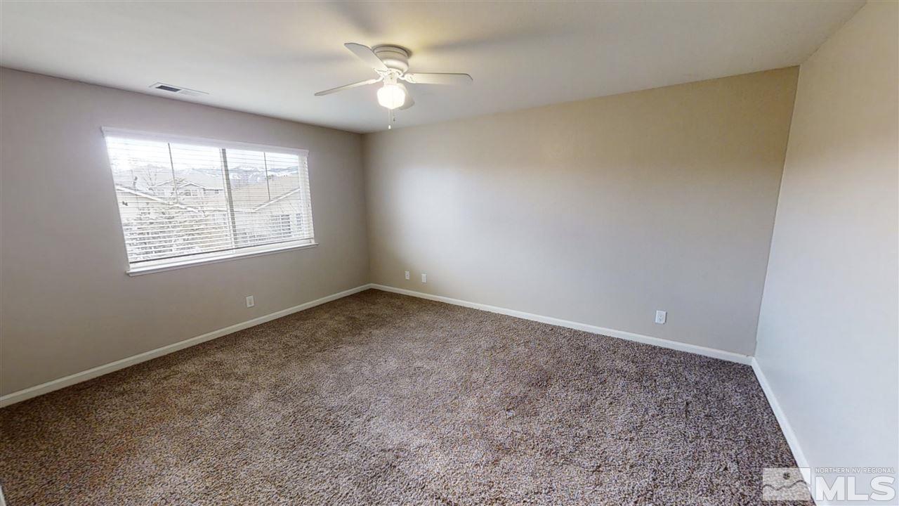 10041 Silver Star Drive Reno, NV 89521 - Photo 13 of 30 an empty room with a window