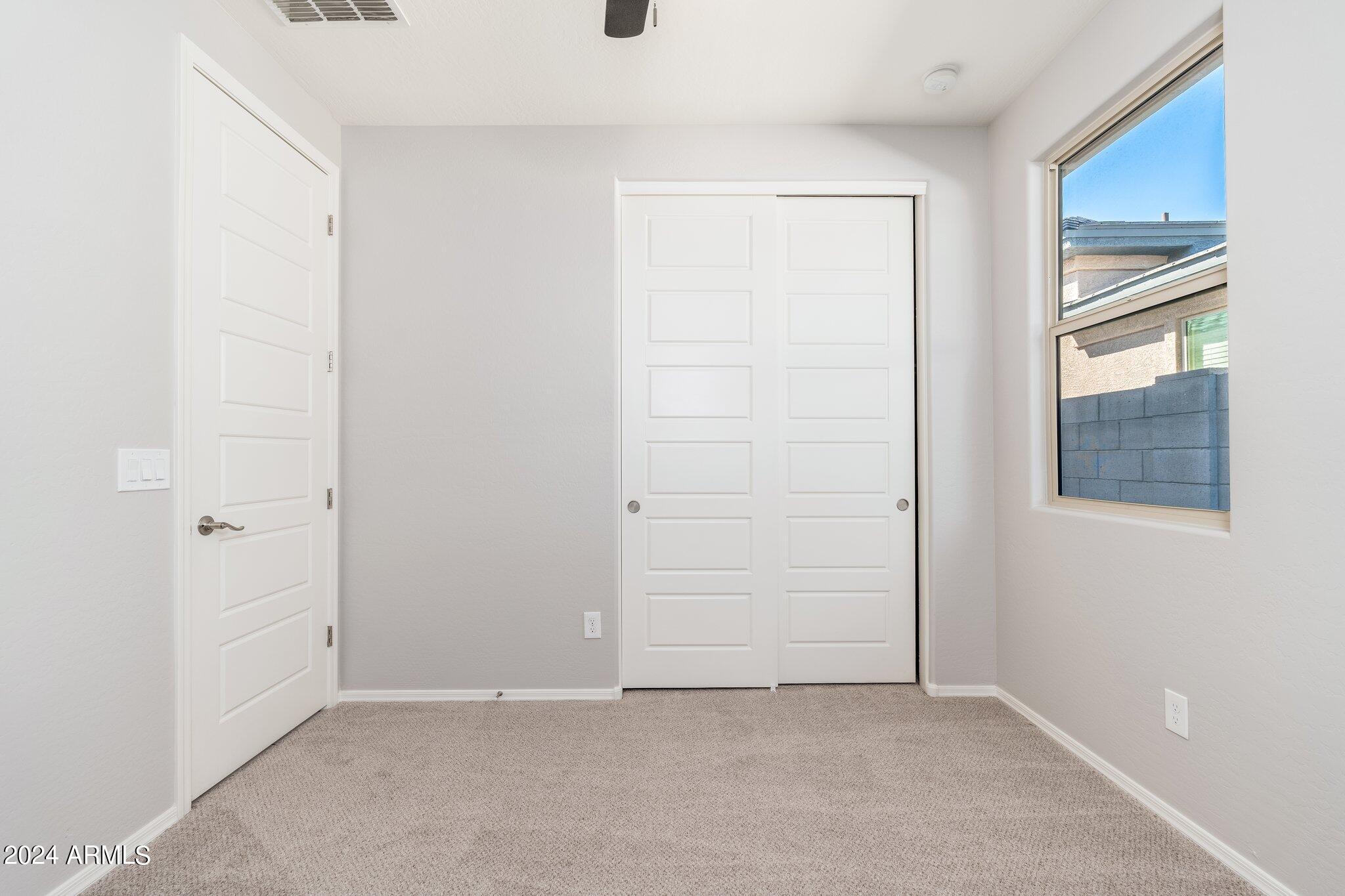 2764 West Apollo Road Phoenix, AZ 85041 - Photo 30 of 45 an empty room with windows
