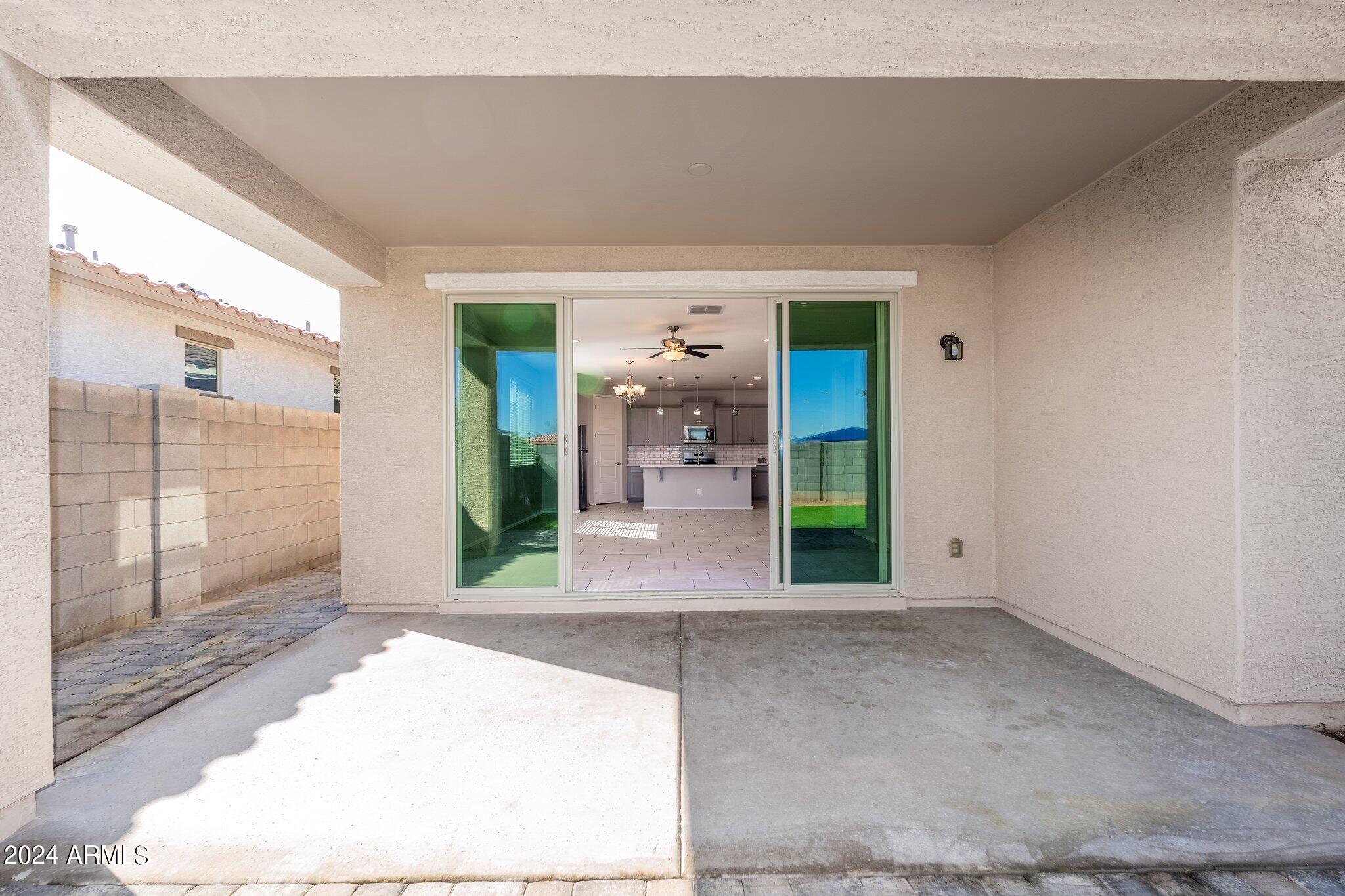 2764 West Apollo Road Phoenix, AZ 85041 - Photo 33 of 45 a view of a hallway with wooden floor and a living room