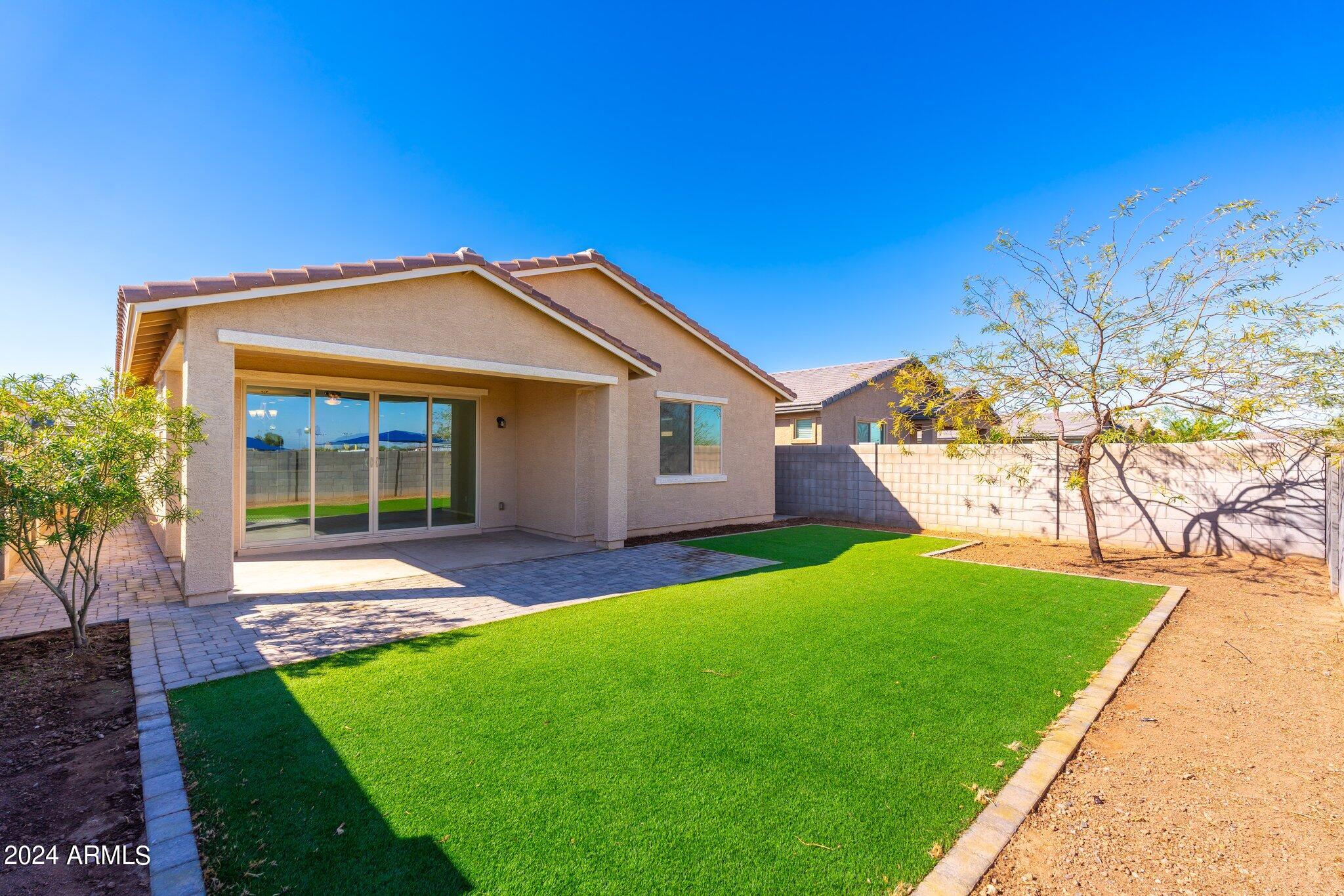 2764 West Apollo Road Phoenix, AZ 85041 - Photo 36 of 45 a view of a house with a yard