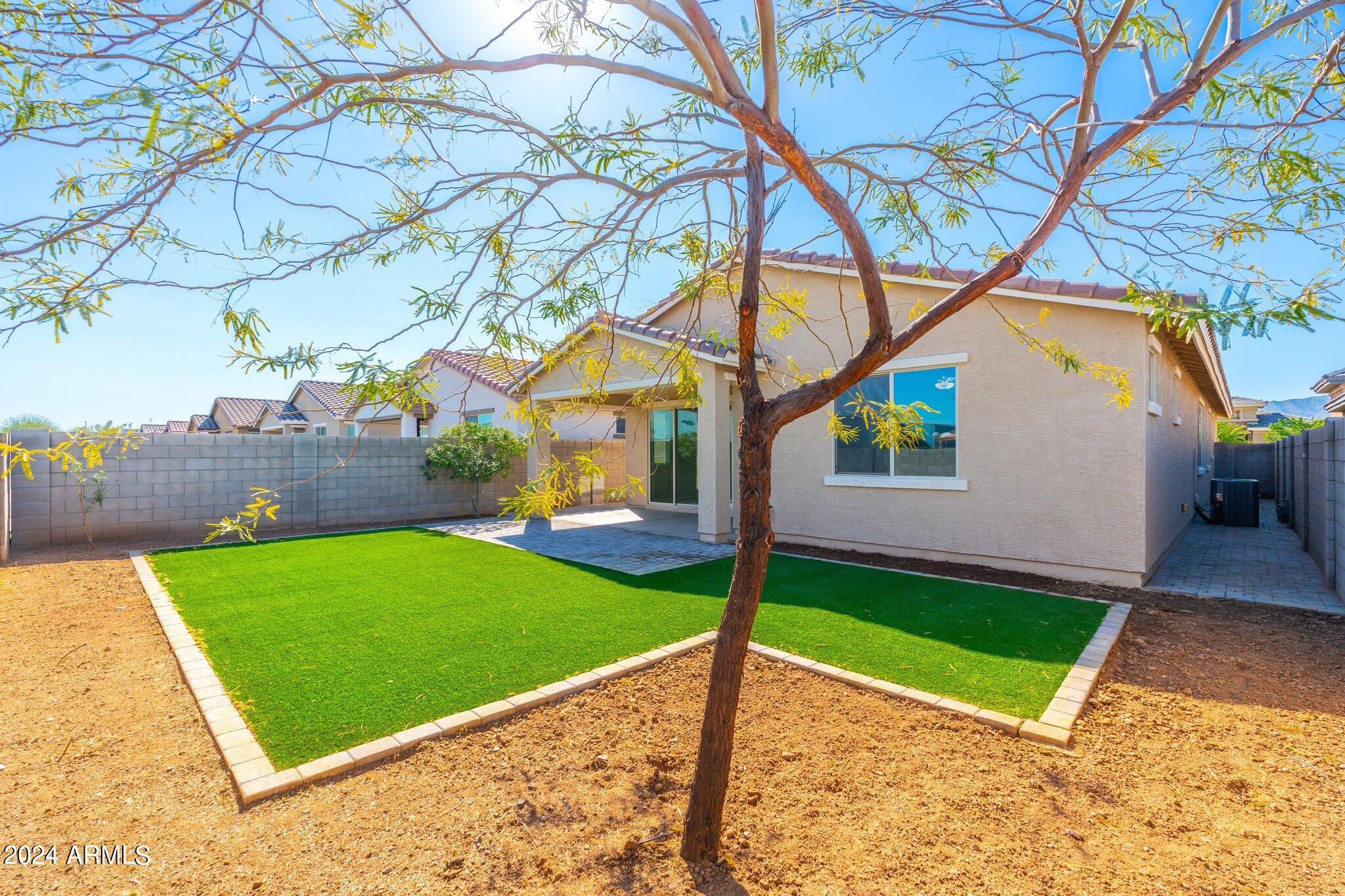 2764 West Apollo Road Phoenix, AZ 85041 - Photo 39 of 45 a view of a backyard with a small house