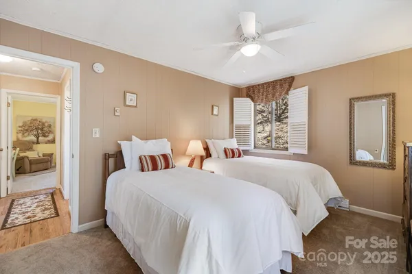 a bedroom with double bed and a window