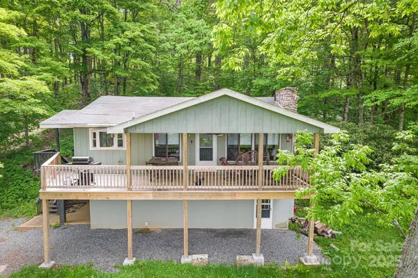 a front view of a house with a garden and porch