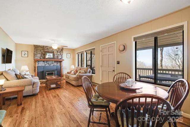 a view of a livingroom with furniture window and wooden floor