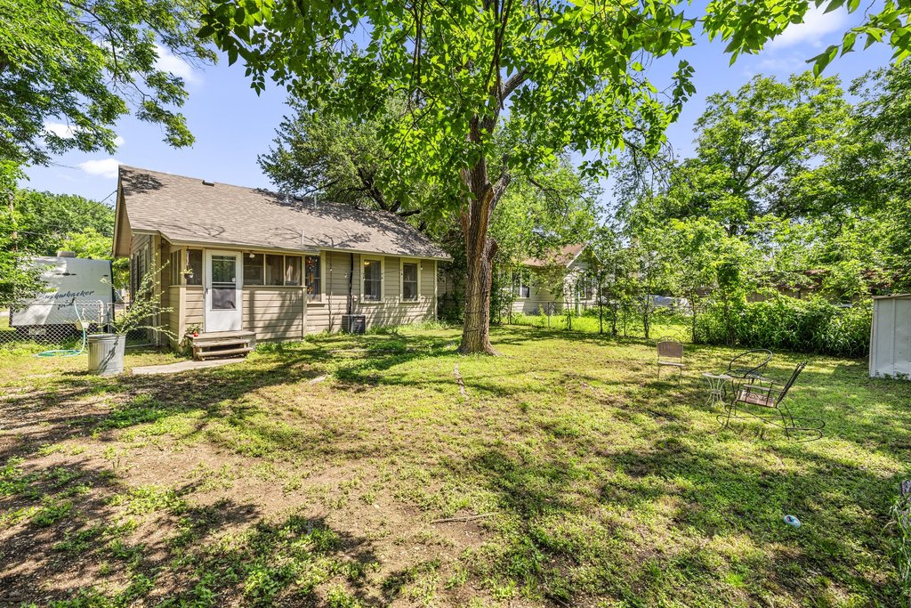 807 Cecelia Street Taylor, TX 76574 - Photo 21 of 24 a view of a house with a yard