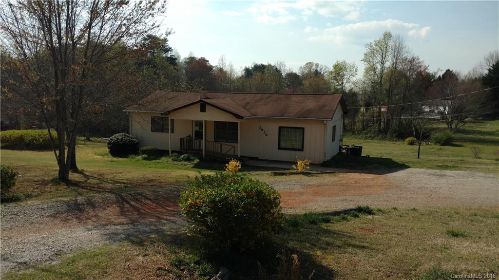 2936 Peniel Road Columbus, NC 28722 - Photo 1 of 4 a view of a house with yard and a garden