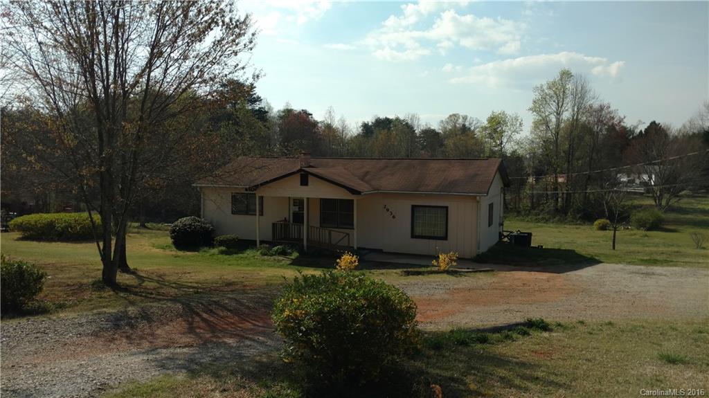 2936 Peniel Road Columbus, NC 28722 - Photo 2 of 4 a front view of a house with garden