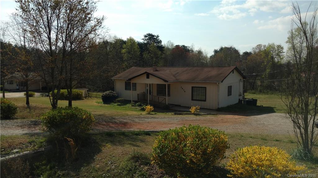 2936 Peniel Road Columbus, NC 28722 - Photo 3 of 4 a view of house with garden